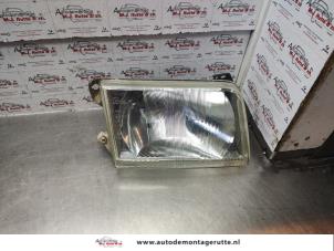 O140015 Gebruikte rechter koplamp Ford Transit