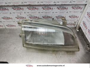 O140690 Gebruikte koplamp rechts Suzuki Swift