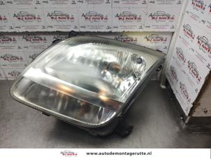 O141118 Gebruikte koplamp links Suzuki Ignis