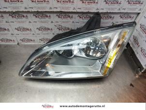O142004 Gebruikte linker koplamp Ford Focus