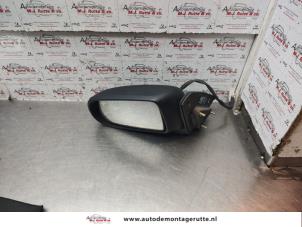 O143017 Gebruikte buitenspiegel links Mazda Demio