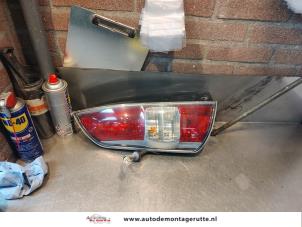 O143444 Gebruikte achterlicht links Daihatsu Sirion