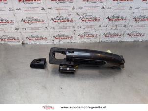 O145005 Gebruikte deurgreep 2deurs links Suzuki Swift