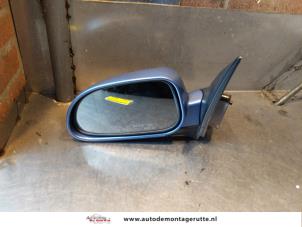 O145552 Gebruikte spiegel buiten links Daewoo Nubira