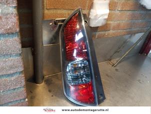 O145569 Gebruikte achterlicht links Daihatsu Sirion
