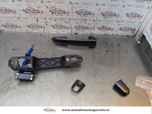 O146802 Gebruikte portiergreep 4deurs links-achter Toyota Yaris