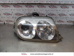 O147310 Gebruikte rechter koplamp Alfa Romeo GTV