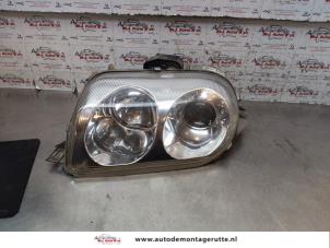 O147318 Gebruikte koplamp links Alfa Romeo GTV