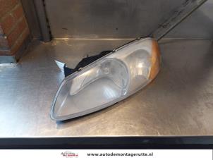 O148008 Gebruikte koplamp links Chrysler Sebring