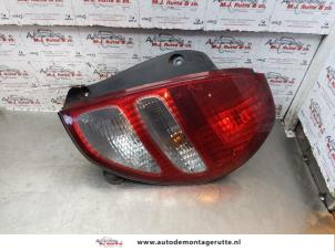 O149700 Gebruikte achterlichtrand rechts Daihatsu Sirion