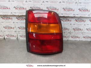 O150635 Gebruikte achterlicht links Nissan Micra