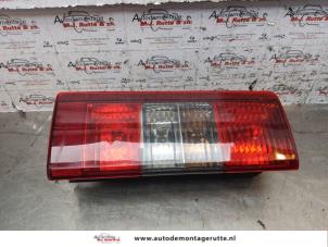O151182 Gebruikte achterlicht links Opel Combo