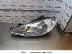 O151699 Gebruikte koplamp links Peugeot 206