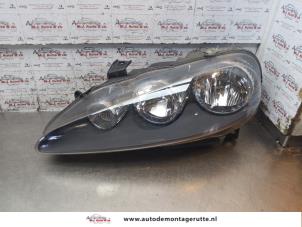 O153140 Gebruikte linker koplamp Alfa Romeo 147