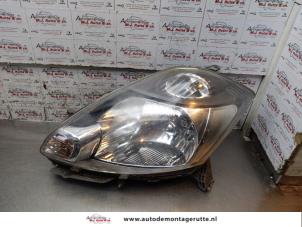 O156793 Gebruikte linker koplamp Daihatsu Sirion
