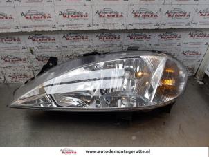 O157115 Gebruikte koplamp links Renault Megane