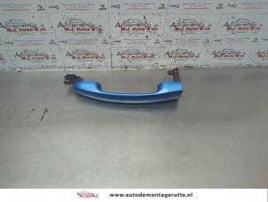 O158851 Gebruikte portiergreep 2deurs links Ford KA