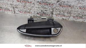 O159443 Gebruikte portiergreep 4deurs links-voor Fiat Punto