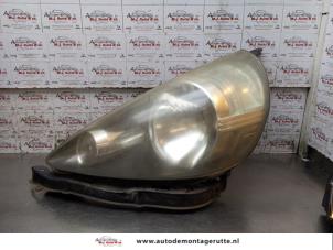 O161810 Gebruikte linker koplamp Honda Jazz