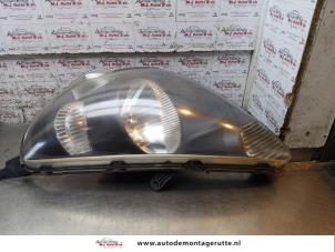 O163188 Gebruikte linker koplamp Honda Jazz