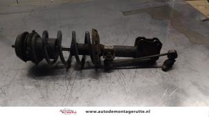 O163634 Gebruikte schokdemperpoot rechts-voor Opel Meriva