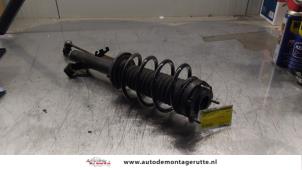 O163887 Gebruikte schokdemperpoot rechts-voor Mazda 2.