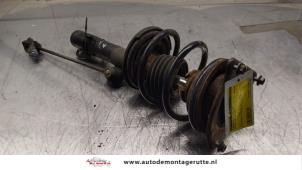 O163911 Gebruikte schokdemperpoot links-voor BMW Mini One