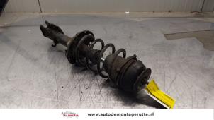 O163915 Gebruikte schokdemperpoot rechts-voor Opel Corsa