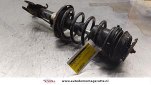 O163933 Gebruikte schokdemperpoot links-voor Opel Meriva