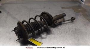 O163977 Gebruikte schokdemperpoot rechts-voor Ford Focus