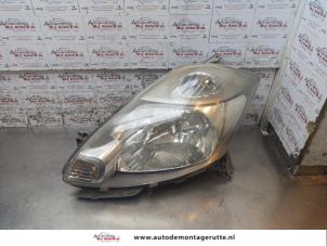 O164011 Gebruikte linker koplamp Daihatsu Sirion