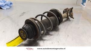 O164229 Gebruikte schokdemperpoot links-voor Nissan Pixo