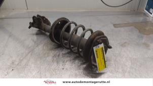 O164410 Gebruikte schokdemperpoot rechts-voor Mitsubishi Colt