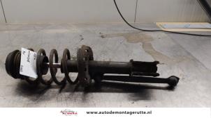 O164909 Gebruikte schokdemperpoot rechts-voor Opel Astra
