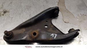 O164926 Gebruikte triangel links-voor Dacia Dokker