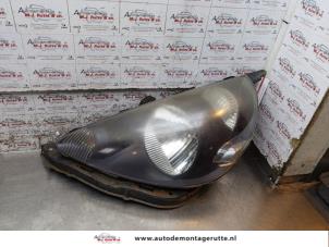 O165144 Gebruikte linker koplamp Honda Jazz