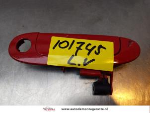 O165484 Gebruikte portiergreep 2deurs links Toyota Yaris