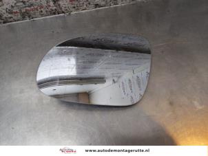O165572 Gebruikte spiegelglas links Volkswagen Golf