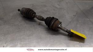 O166212 Gebruikte aandrijfas links-voor Nissan Primera