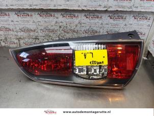 O166256 Gebruikte achterlicht links Subaru Justy