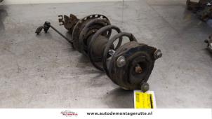 O167024 Gebruikte schokdemperpoot links-voor Renault Modus