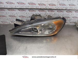 O167286 Gebruikte linker koplamp Nissan Primera
