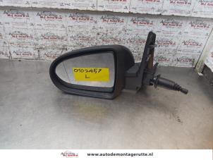 O167590 Gebruikte spiegel buiten links Mitsubishi Colt