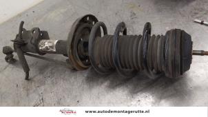 O167813 Gebruikte schokdemperpoot rechts-voor Opel Corsa