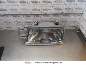O168689 Gebruikte koplamp links Fiat Tempra