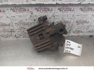 O168842 Gebruikte remklauw (tang) links-achter BMW Mini One