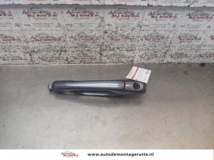 O168855 Gebruikte portiergreep 4deurs links-voor Mitsubishi Lancer