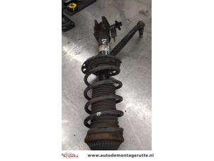 O169107 Gebruikte schokdemperpoot links-achter Opel Astra