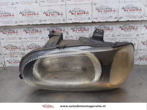 O169197 Gebruikte koplamp links Suzuki Alto