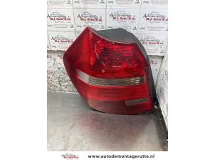 O169378 Gebruikte achterlichtglas links BMW 1-Serie